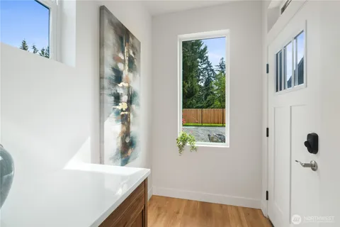 a view of kitchen with wooden floor and window