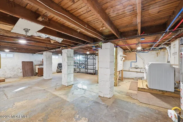 a view of a room with wooden ceiling
