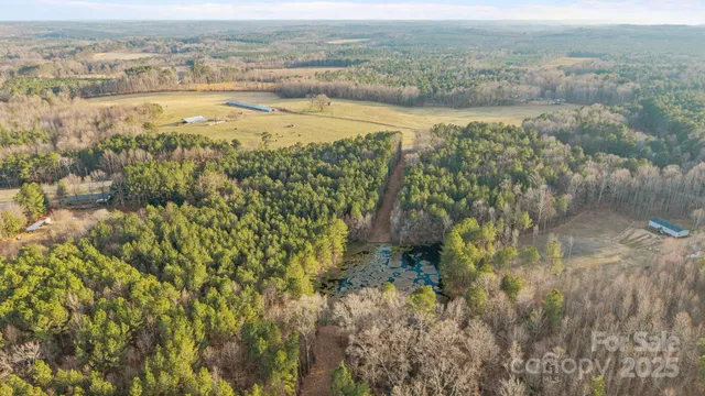a view of a lake with beach and city view