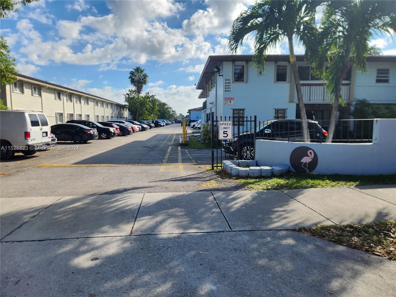 6259 West 24th Avenue, Unit 1028 Hialeah, FL 33016 - Photo 2 of 22 a front view of a house with garden