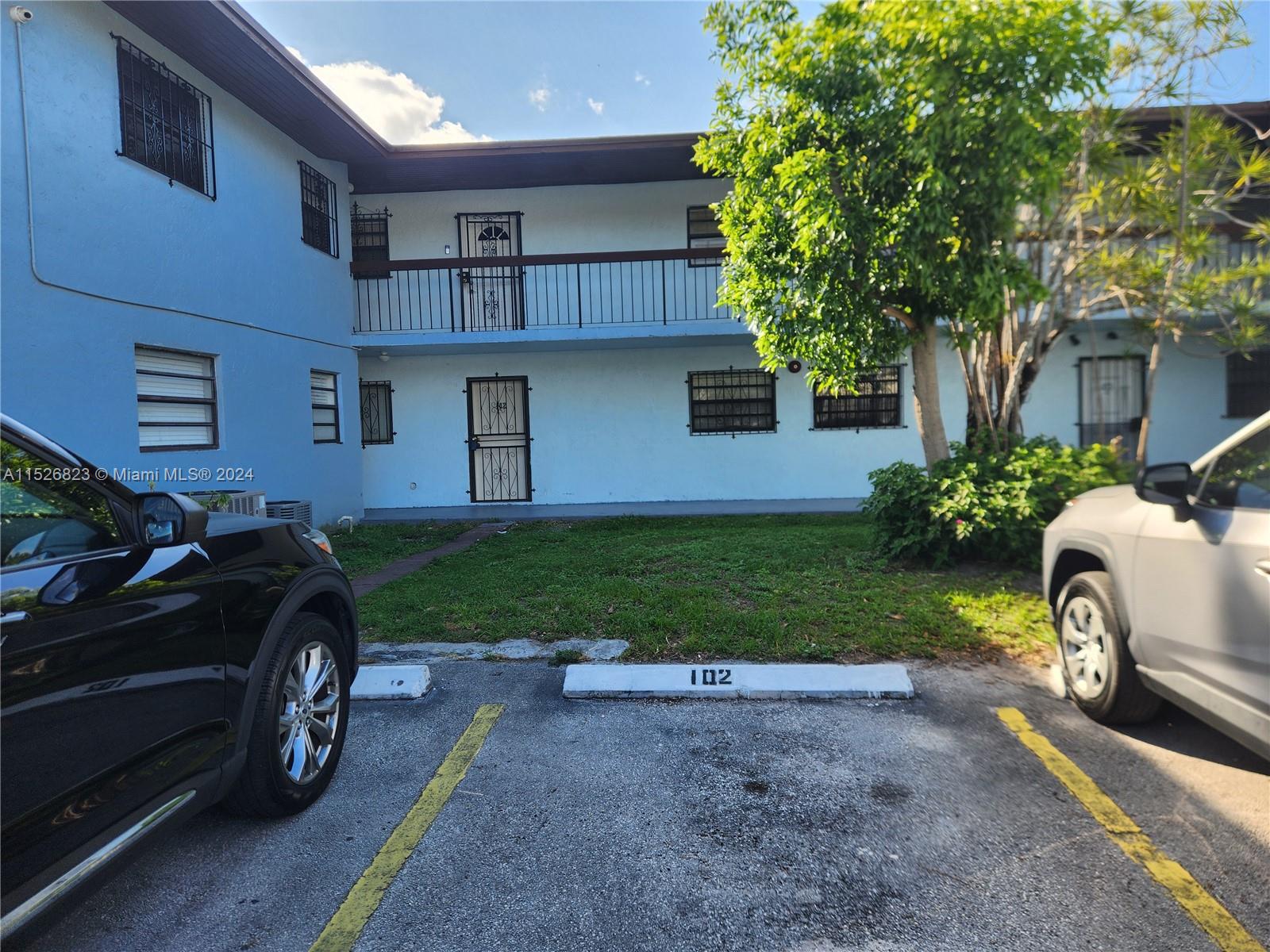 6259 West 24th Avenue, Unit 1028 Hialeah, FL 33016 - Photo 5 of 22 a car parked in front of a house