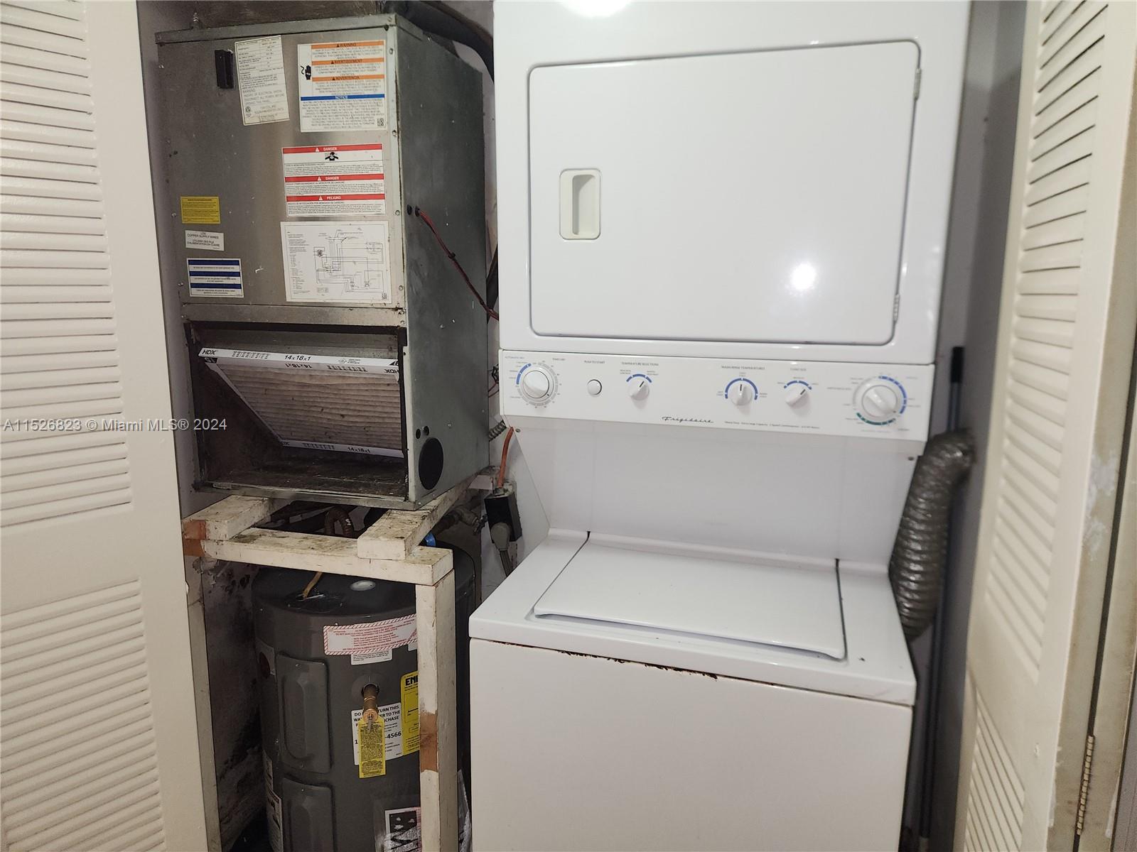 6259 West 24th Avenue, Unit 1028 Hialeah, FL 33016 - Photo 10 of 22 a utility room with dryer and washer
