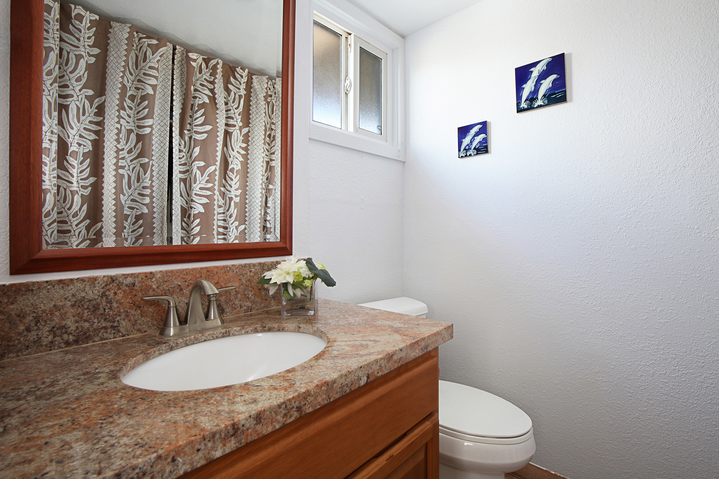 1661 Pee Road, Unit IIA312 Koloa, HI 96756 - Photo 12 of 30 a bathroom with a granite countertop sink and a mirror