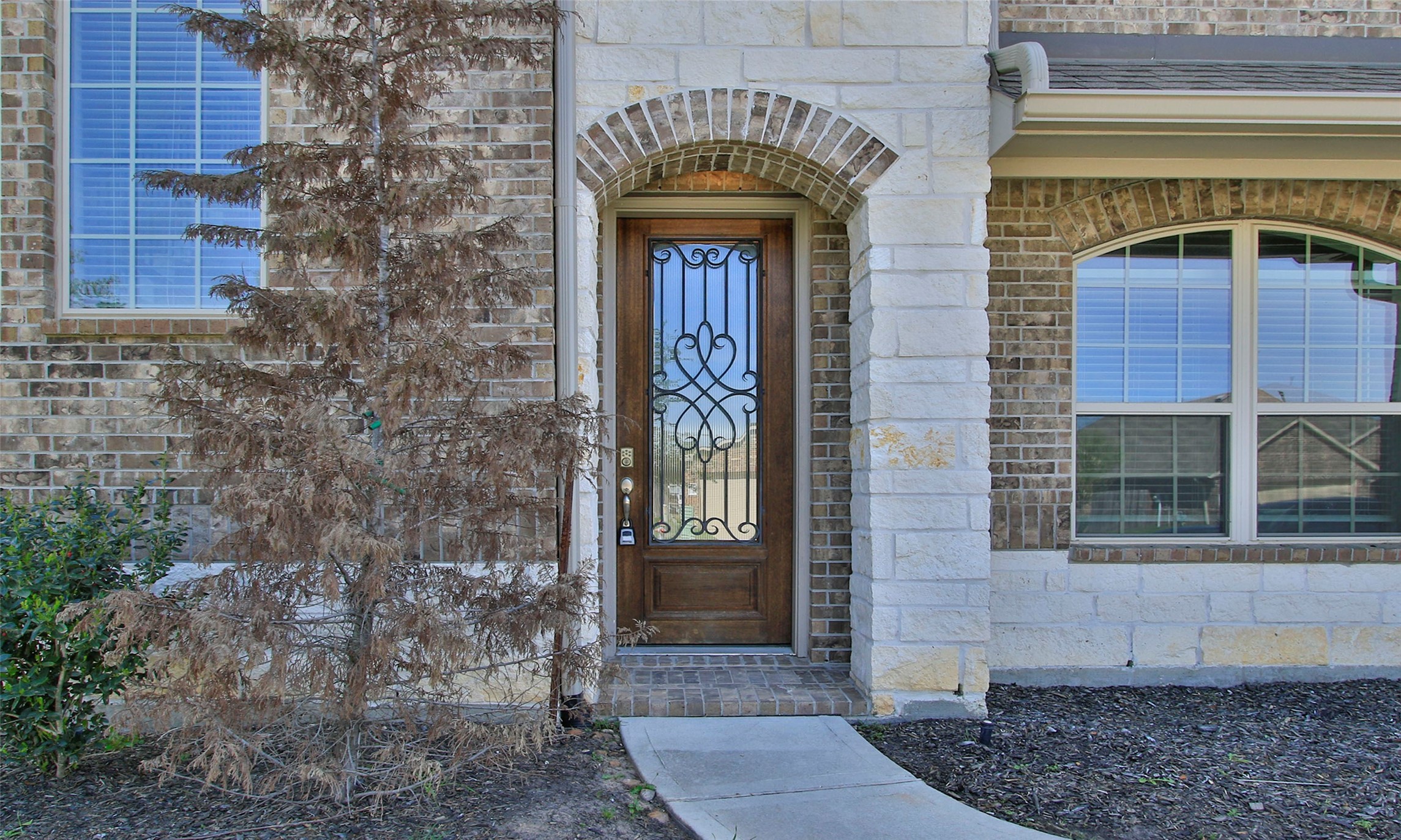 14120 Sand Ridge Court Conroe, TX 77384 - Photo 3 of 43 a front view of a house with a door