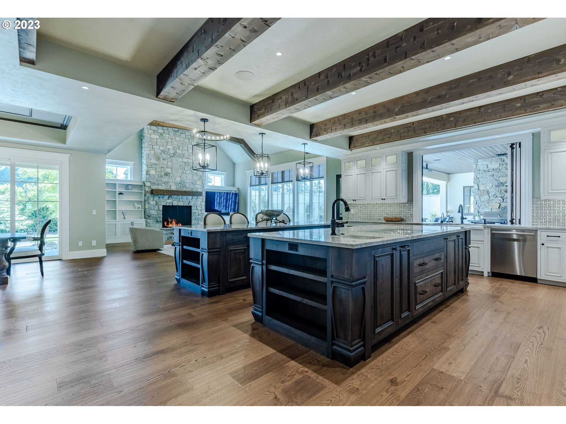 4075 Gilham Road Eugene, OR 97408 - Photo 11 of 48 a kitchen with stainless steel appliances kitchen island wooden cabinets and granite counter tops