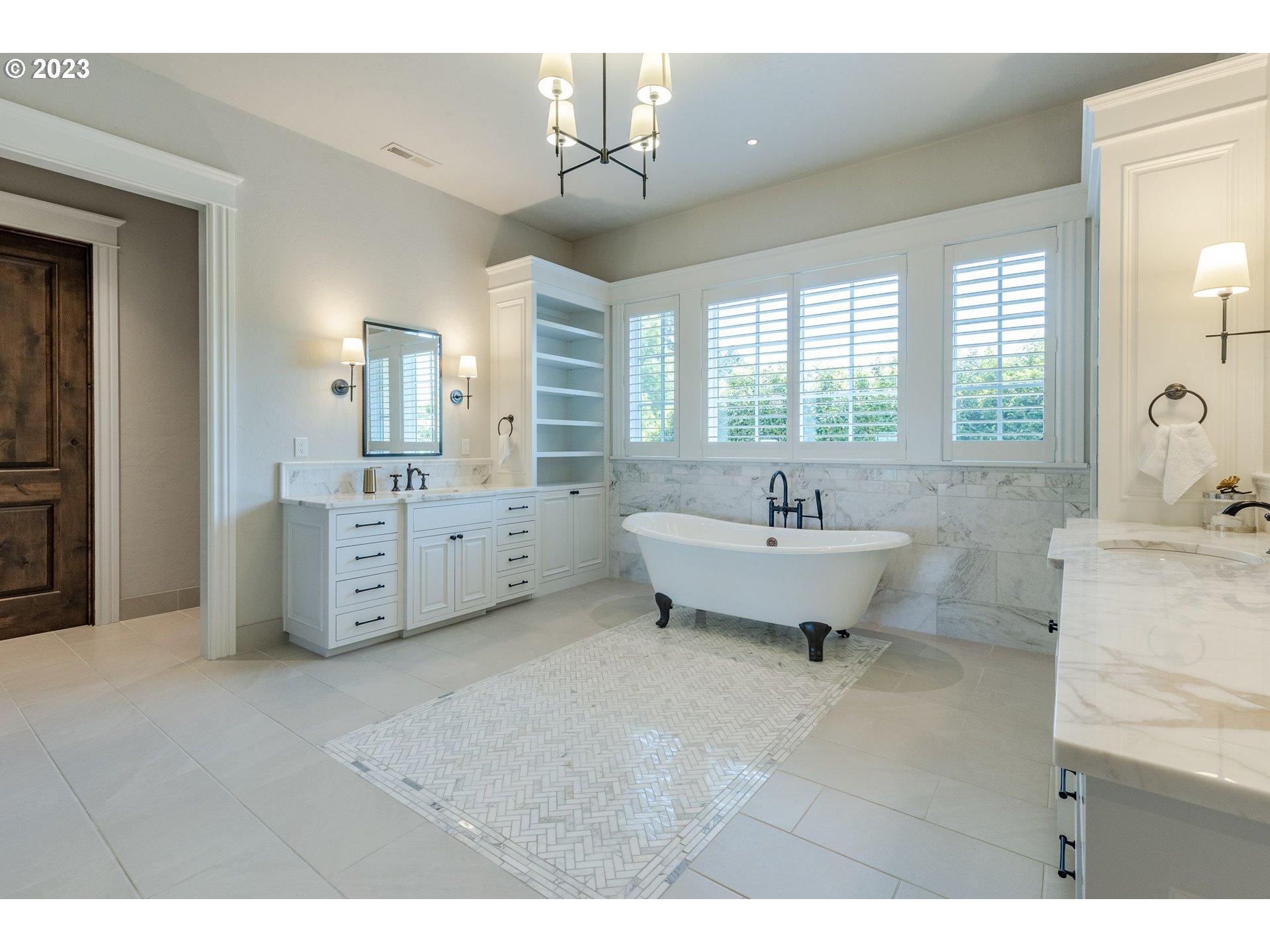 4075 Gilham Road Eugene, OR 97408 - Photo 21 of 48 a spacious bathroom with a double vanity sink a mirror and a bathtub