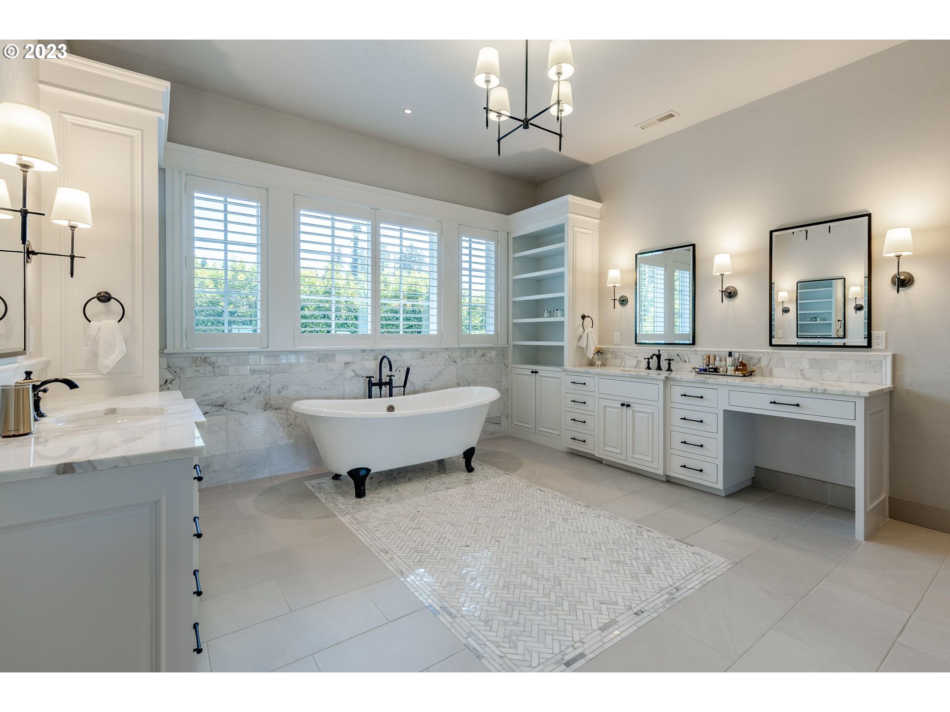 4075 Gilham Road Eugene, OR 97408 - Photo 22 of 48 a spacious bathroom with a double vanity sink a mirror and a bathtub