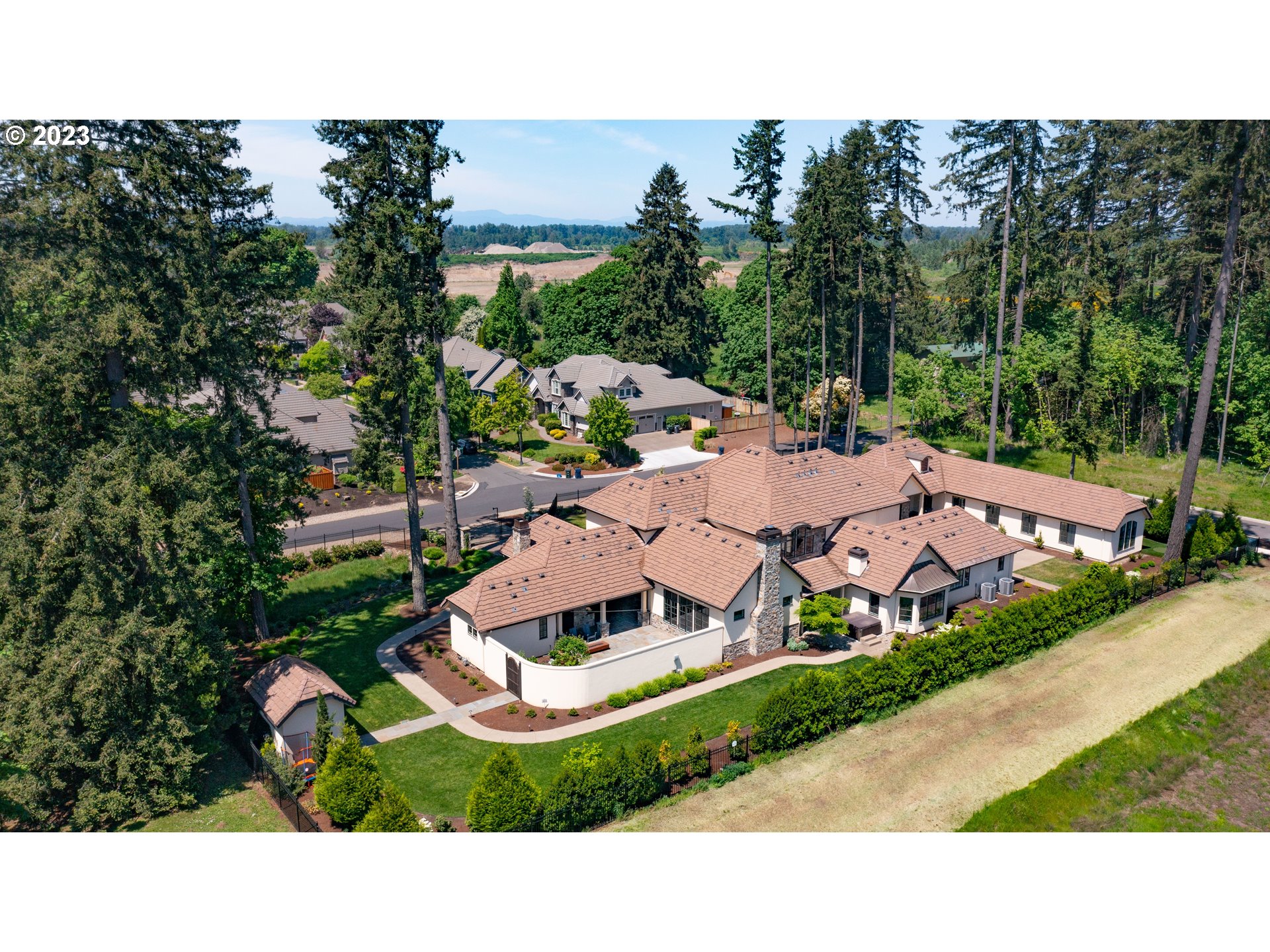 4075 Gilham Road Eugene, OR 97408 - Photo 3 of 48 a aerial view of a house with a garden and trees