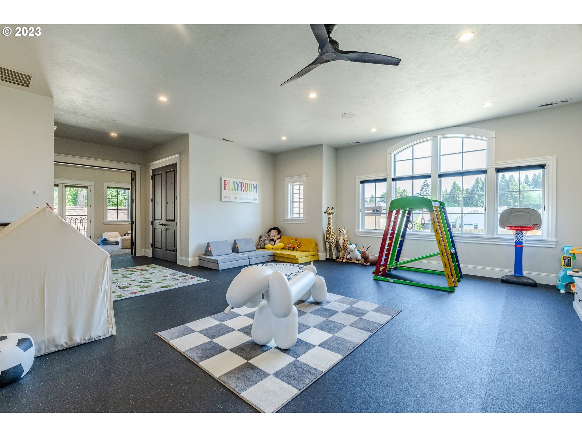 4075 Gilham Road Eugene, OR 97408 - Photo 32 of 48 a living room with furniture and a wooden floor