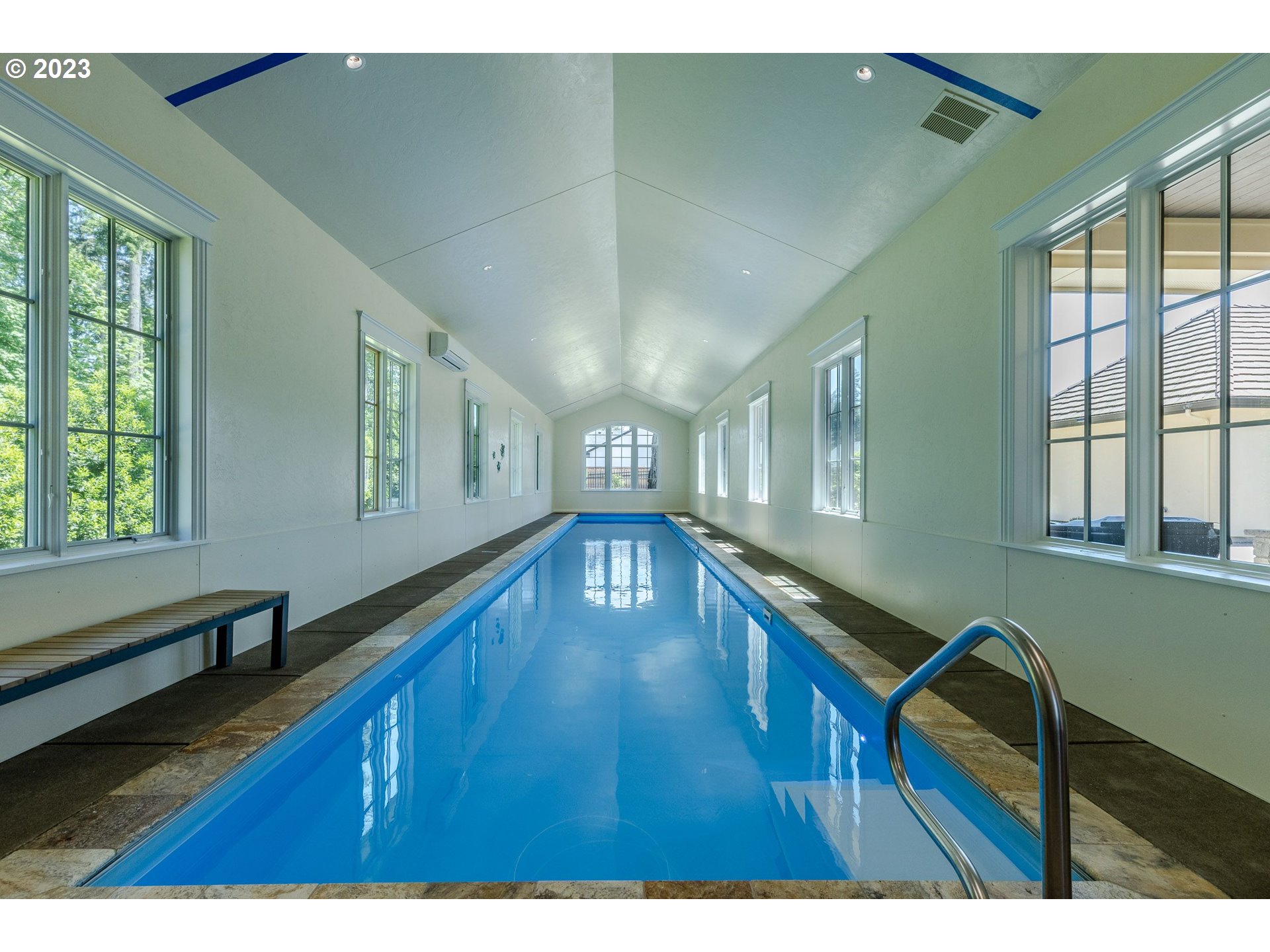 4075 Gilham Road Eugene, OR 97408 - Photo 41 of 48 a hallway with hardwood floor and large windows