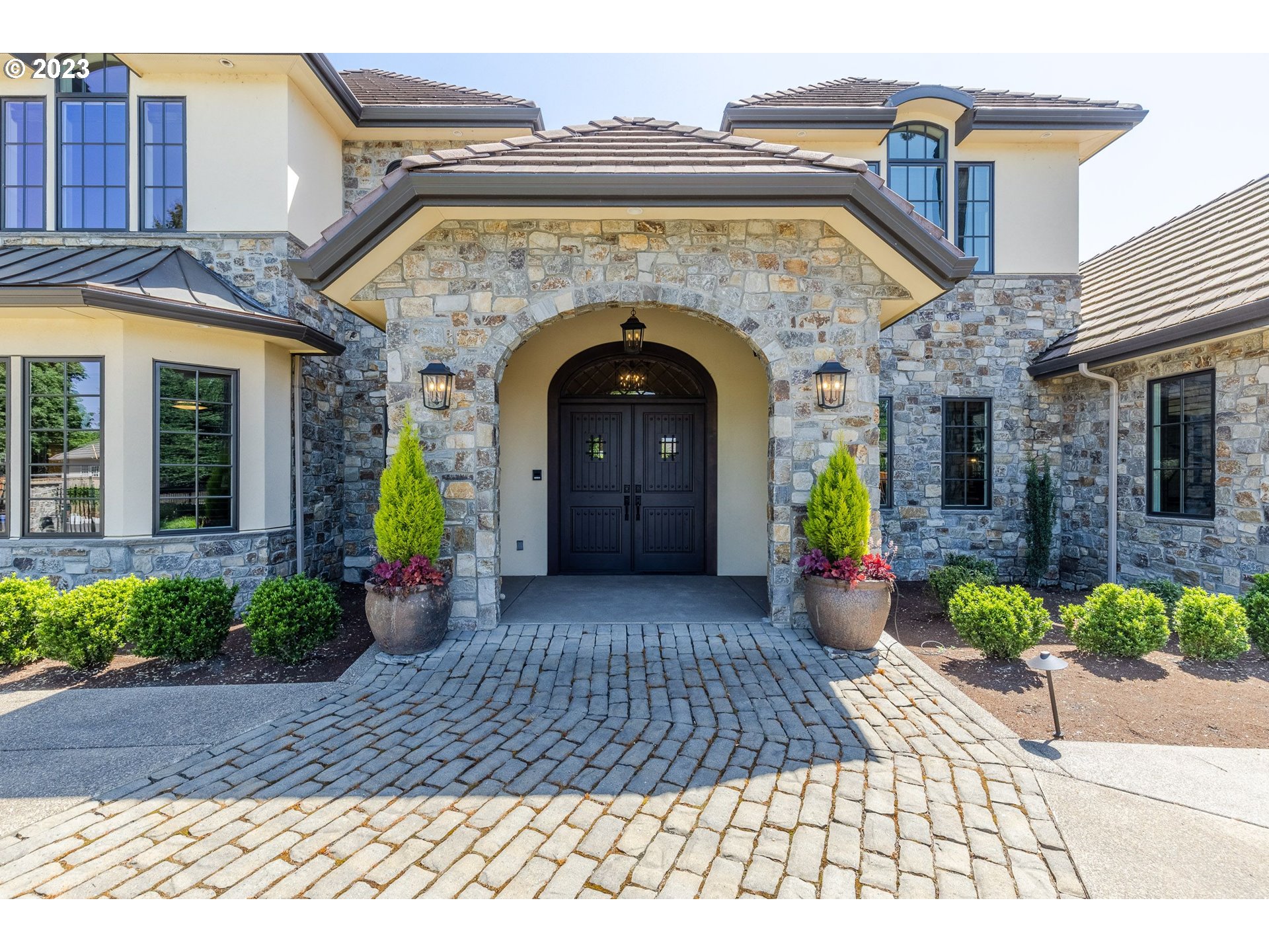 4075 Gilham Road Eugene, OR 97408 - Photo 7 of 48 a view of a grey house with potted plants