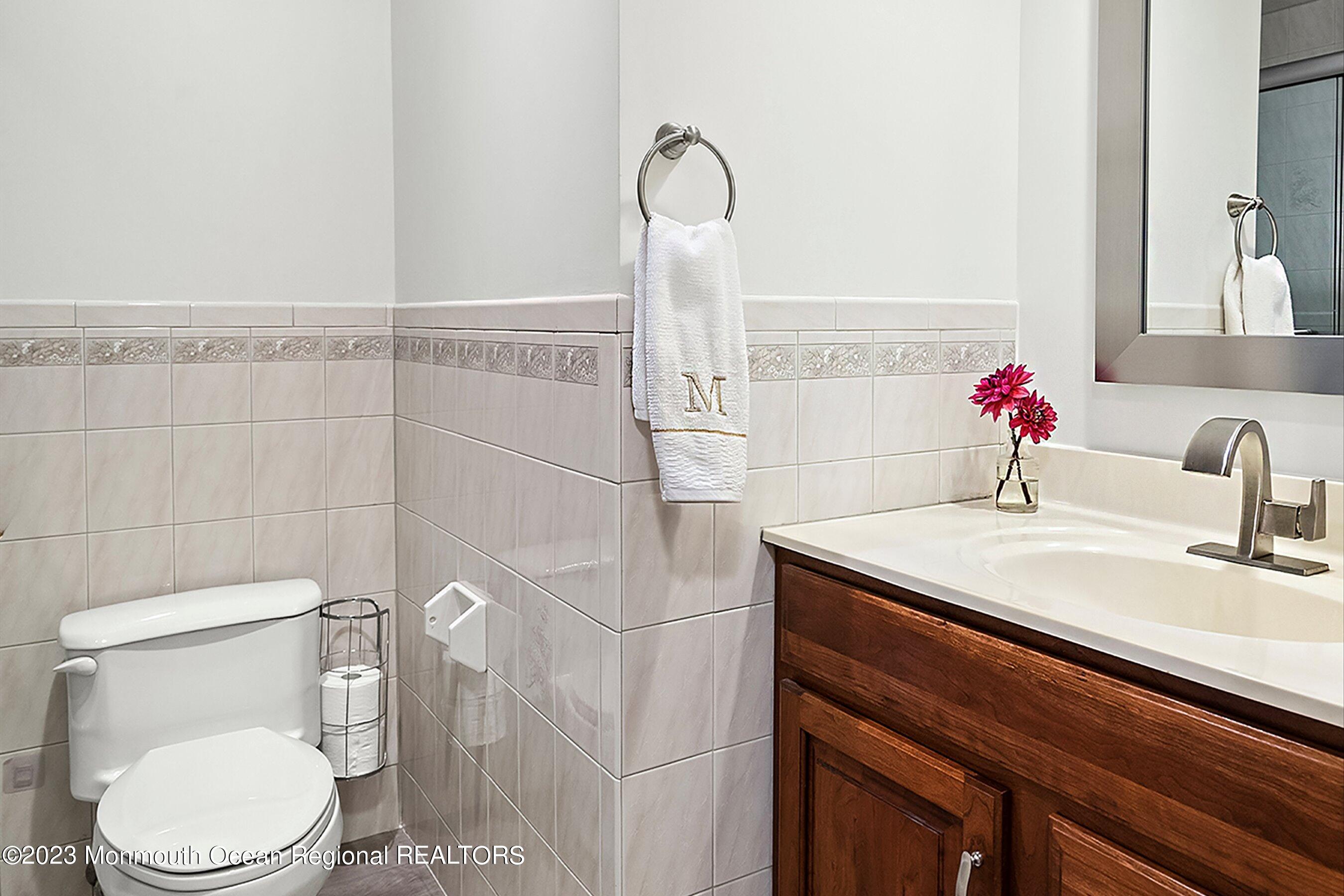 146 Peskin Road Farmingdale, NJ 07727 - Photo 15 of 31 a bathroom with a sink vanity mirror and toilet