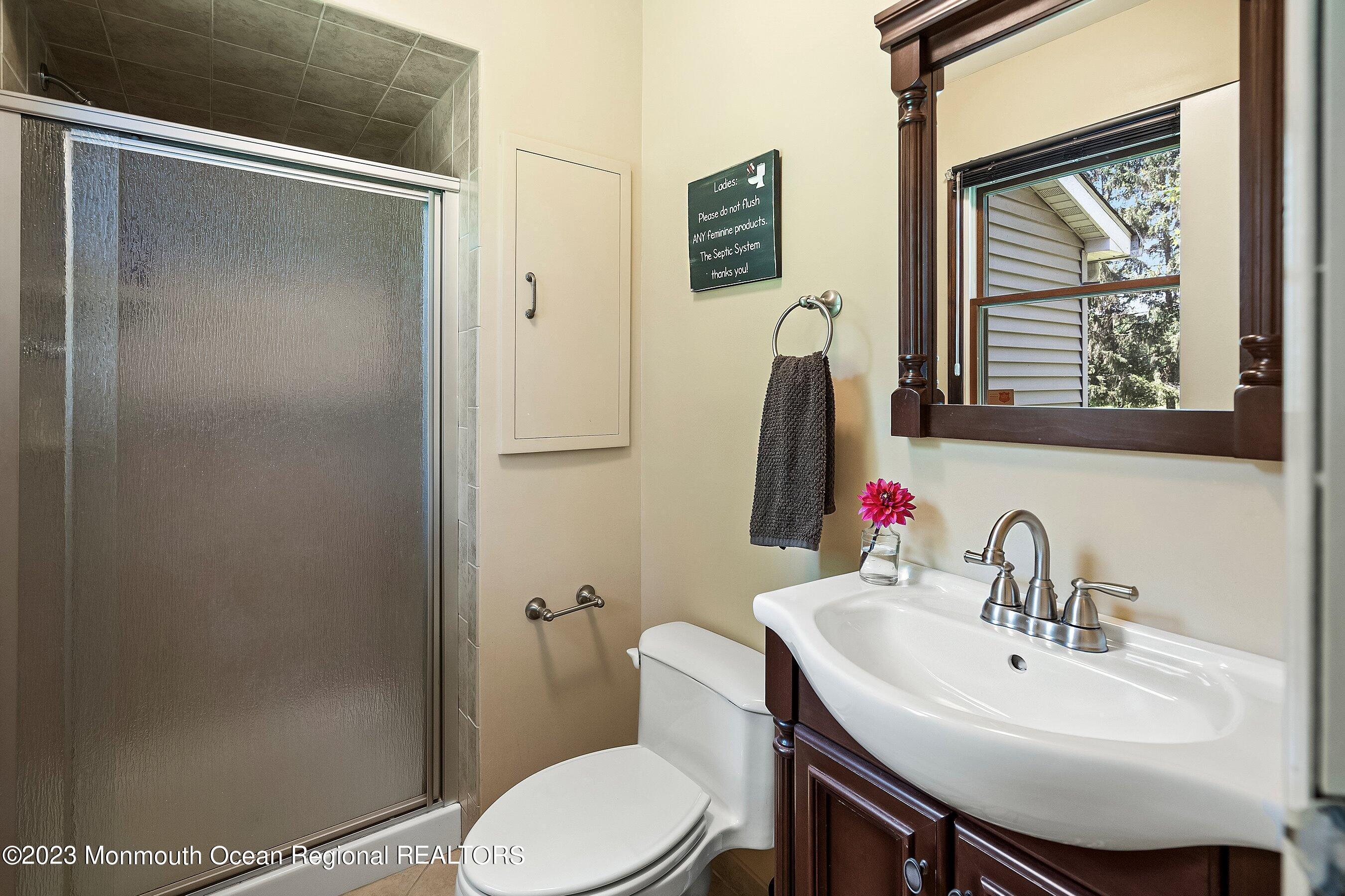 146 Peskin Road Farmingdale, NJ 07727 - Photo 19 of 31 a bathroom with a sink toilet and a mirror