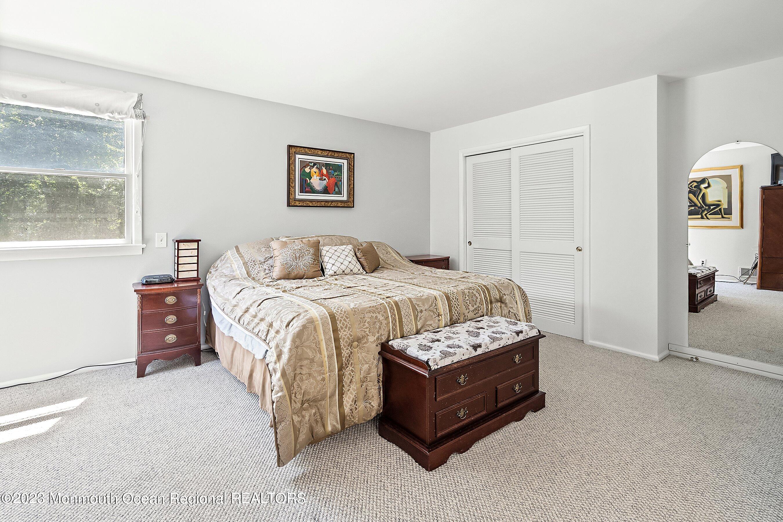 146 Peskin Road Farmingdale, NJ 07727 - Photo 20 of 31 a bedroom with a bed and a painting on the wall