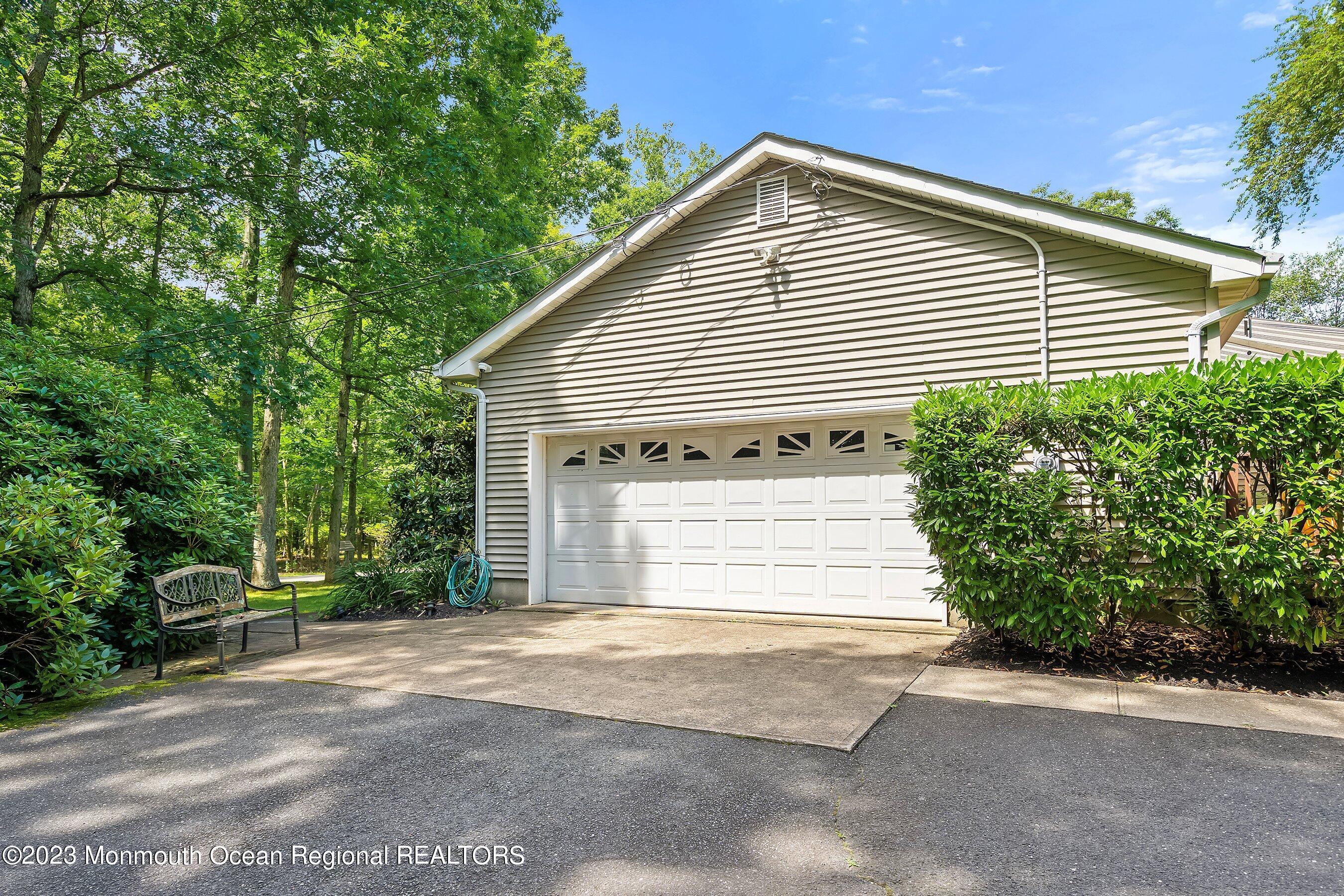 146 Peskin Road Farmingdale, NJ 07727 - Photo 23 of 31 a front view of a house with a garage