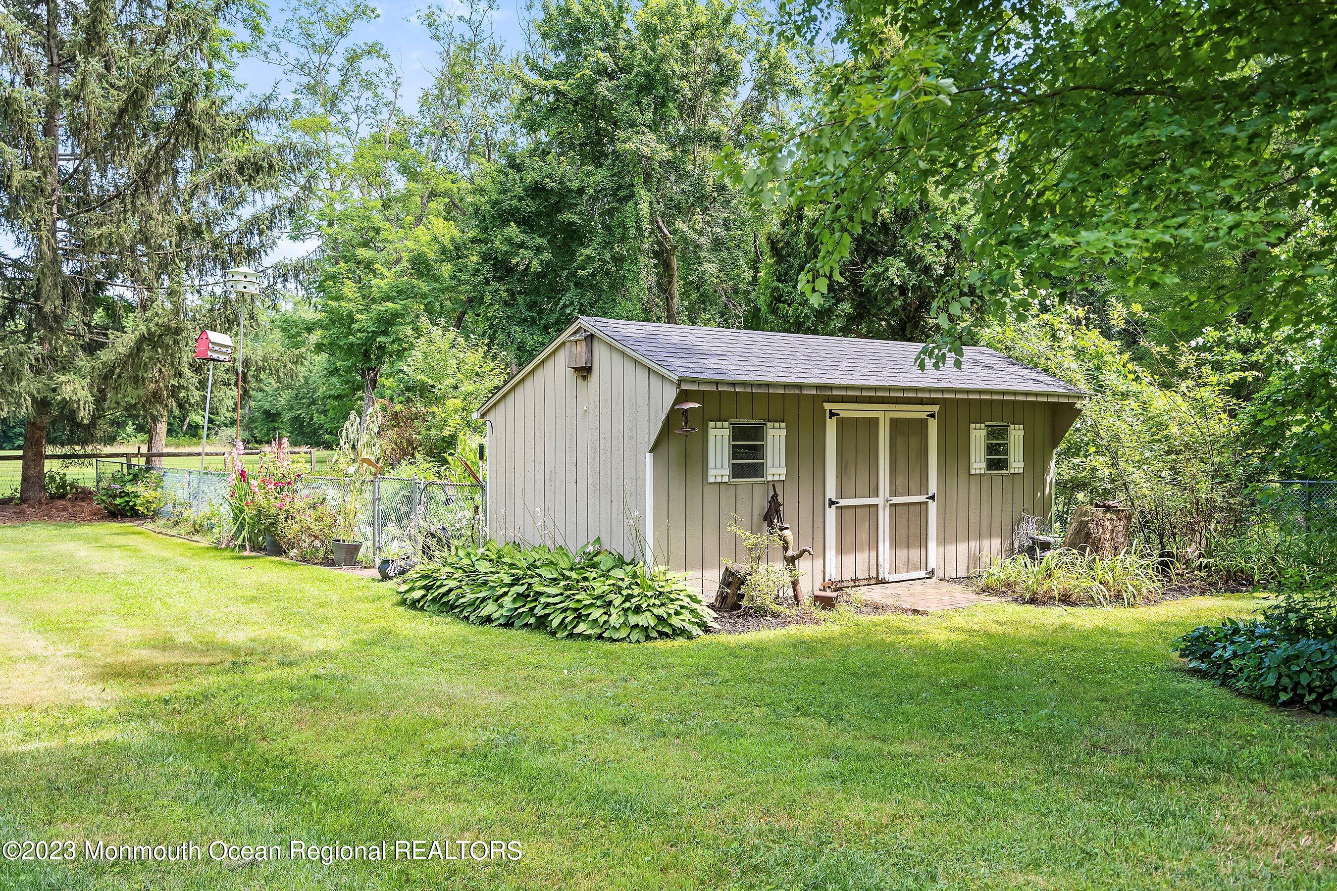 146 Peskin Road Farmingdale, NJ 07727 - Photo 27 of 31 a view of a house with a yard and sitting area