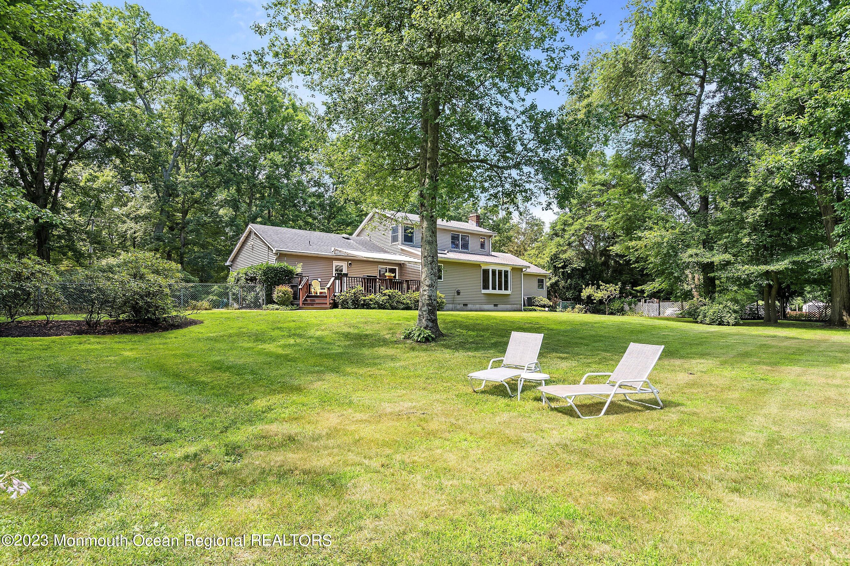 146 Peskin Road Farmingdale, NJ 07727 - Photo 28 of 31 a view of a house with garden and trees