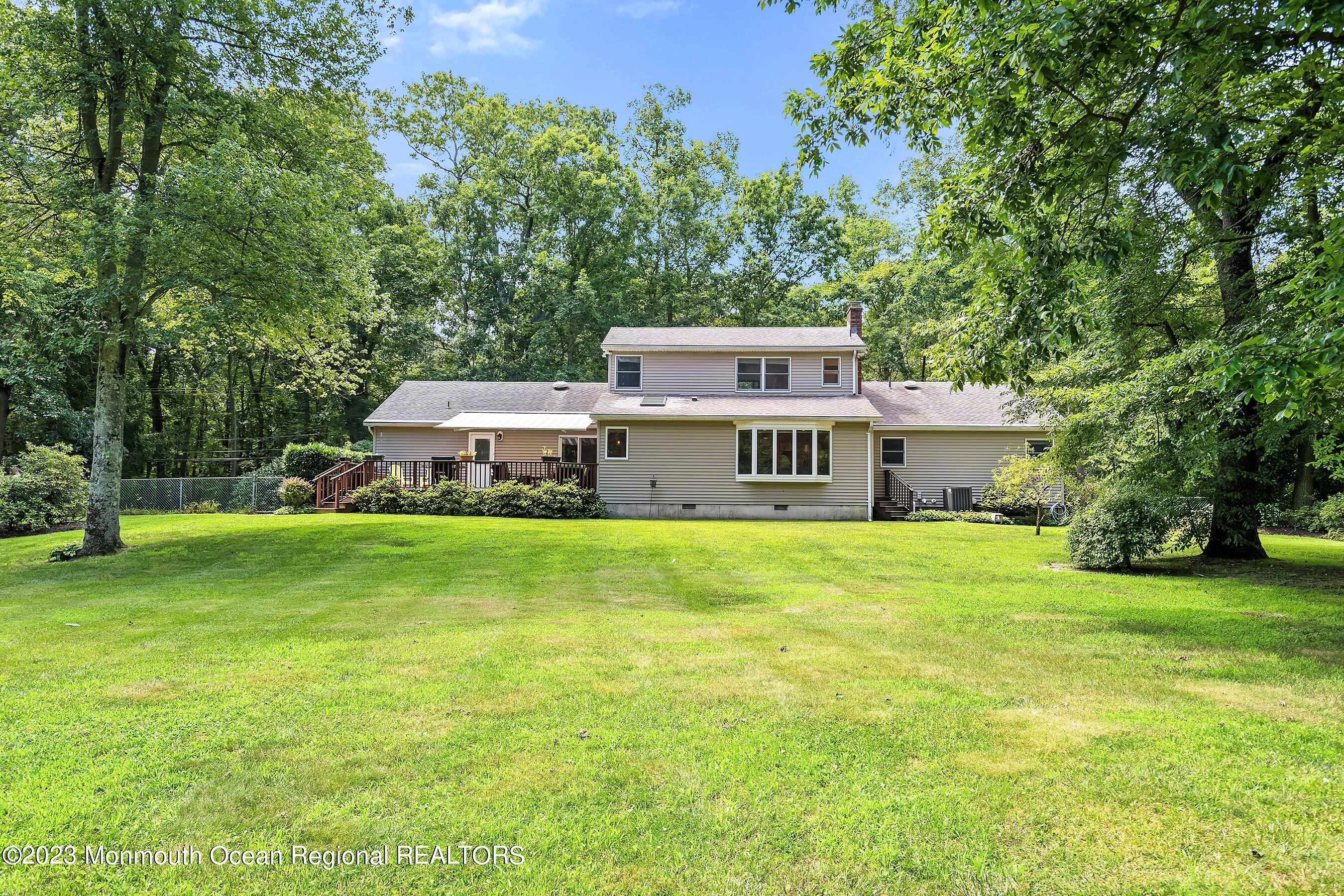 146 Peskin Road Farmingdale, NJ 07727 - Photo 29 of 31 a front view of a house with a garden