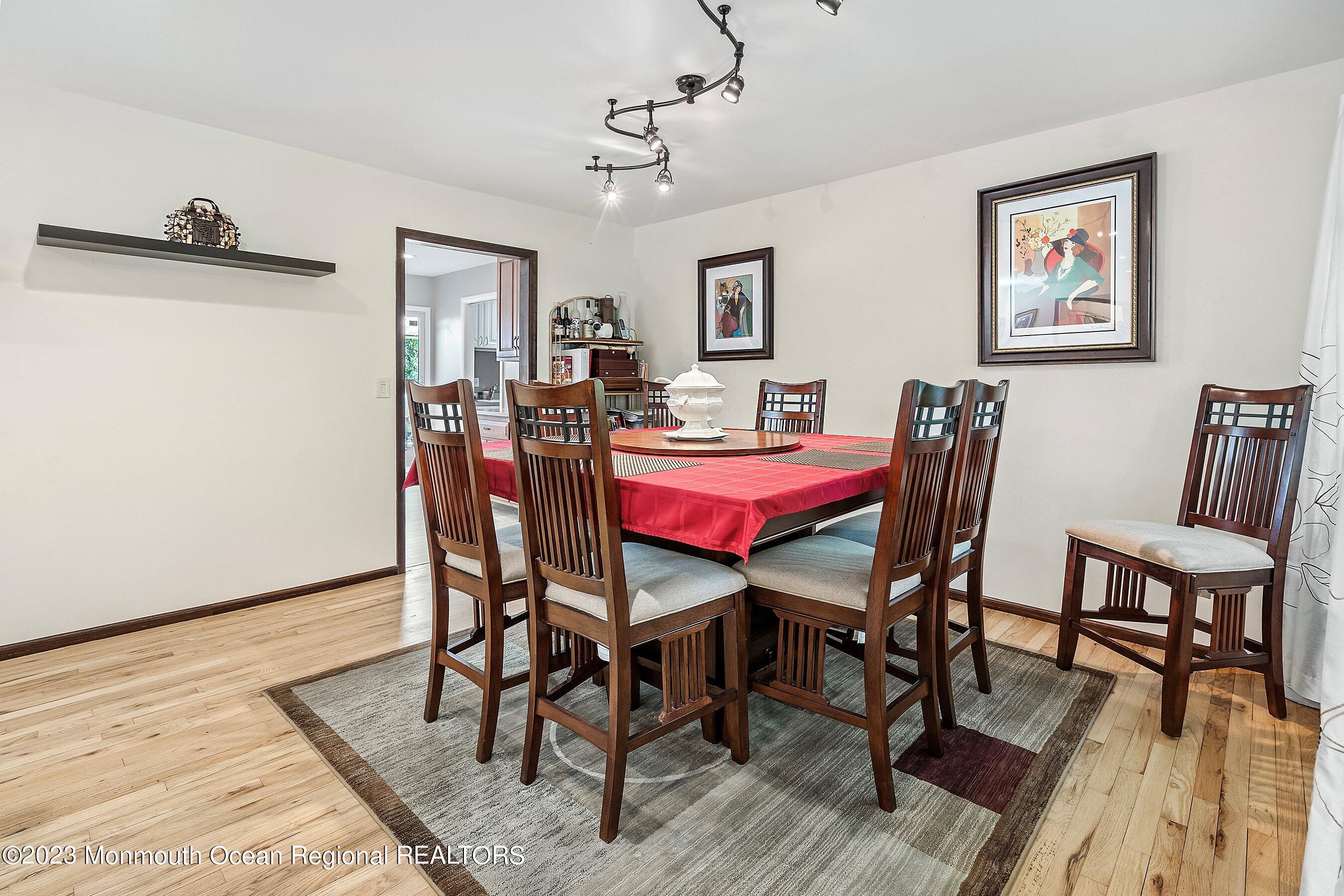 146 Peskin Road Farmingdale, NJ 07727 - Photo 8 of 31 a view of a dining room with furniture and wooden floor