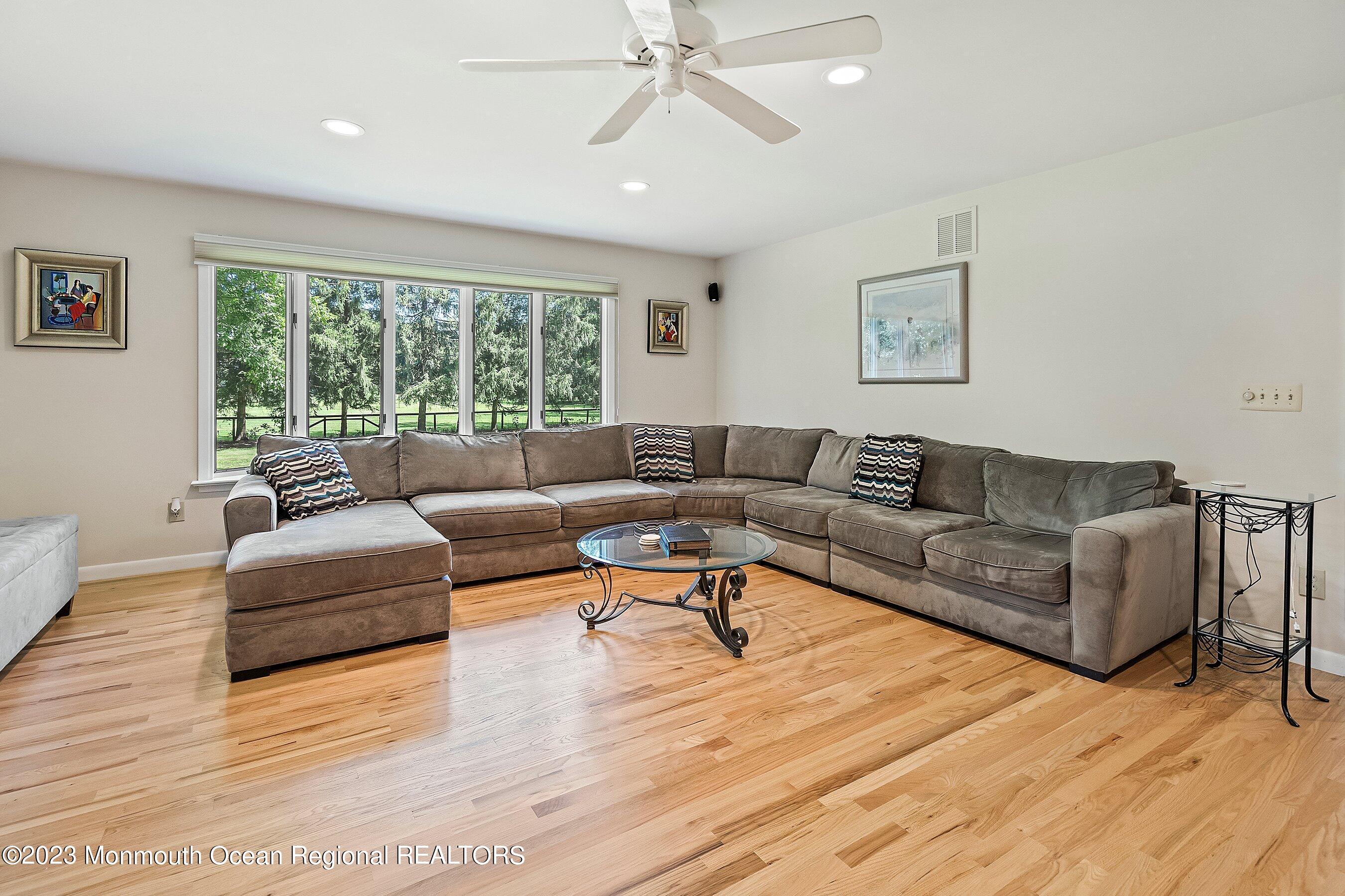 146 Peskin Road Farmingdale, NJ 07727 - Photo 9 of 31 a living room with furniture and a large window