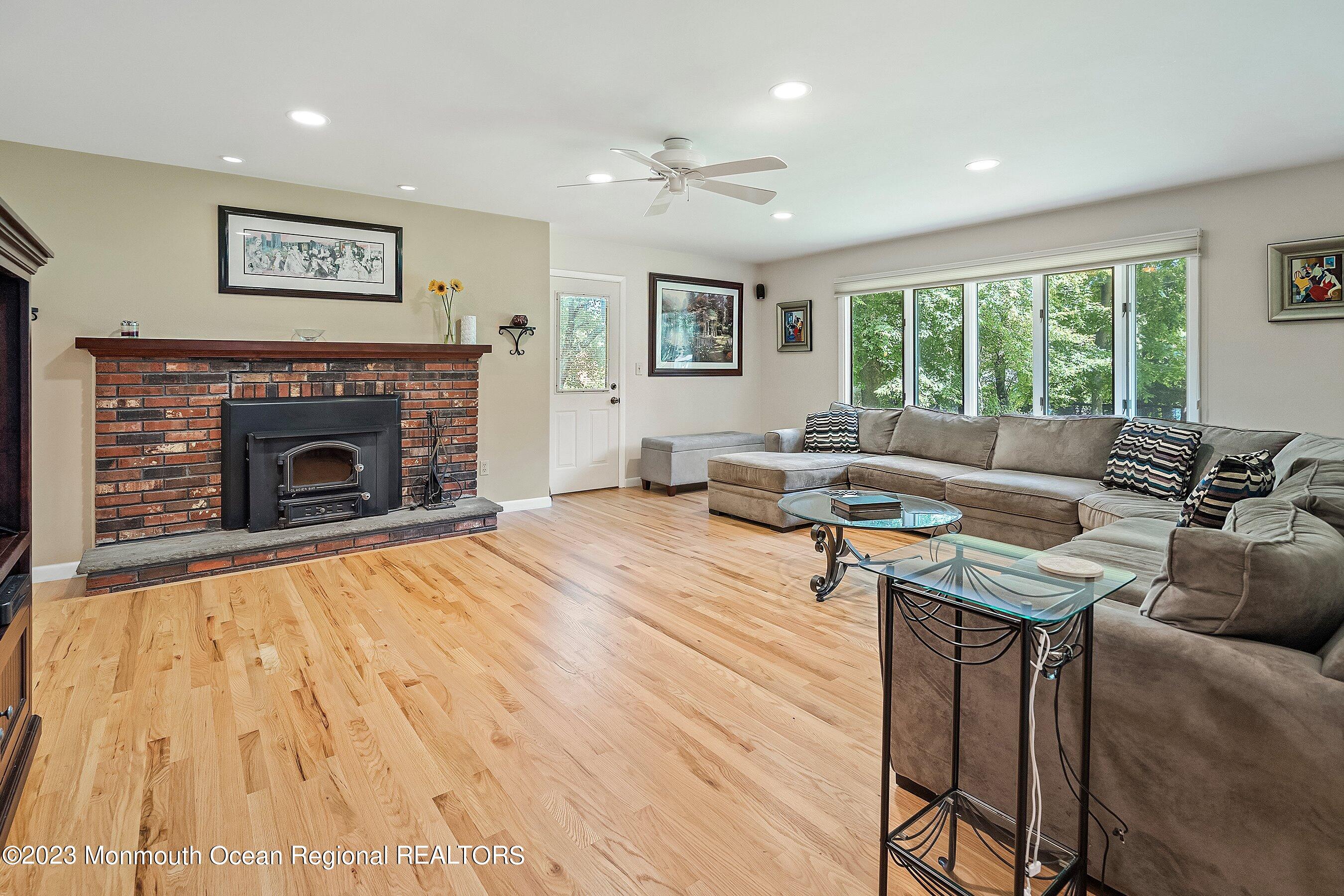 146 Peskin Road Farmingdale, NJ 07727 - Photo 10 of 31 a living room with furniture and a fireplace