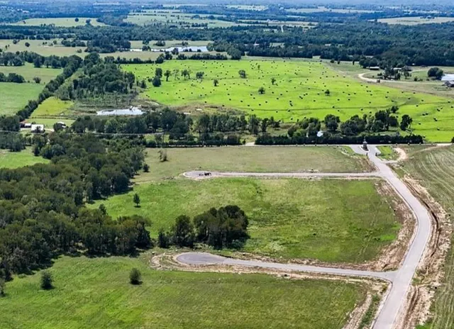 a view of a swimming pool with a yard