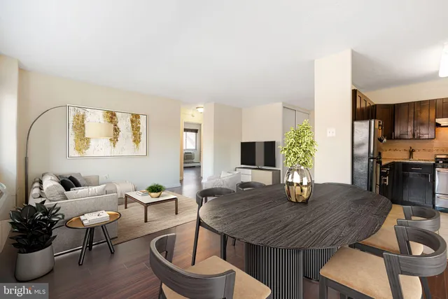 a dining room with furniture and wooden floor
