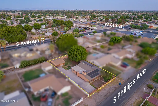 an aerial view of residential houses with outdoor space