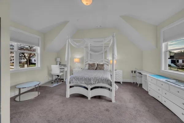 a bedroom with furniture and window
