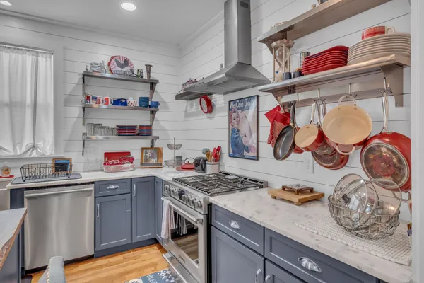 a kitchen with a stove and cabinets