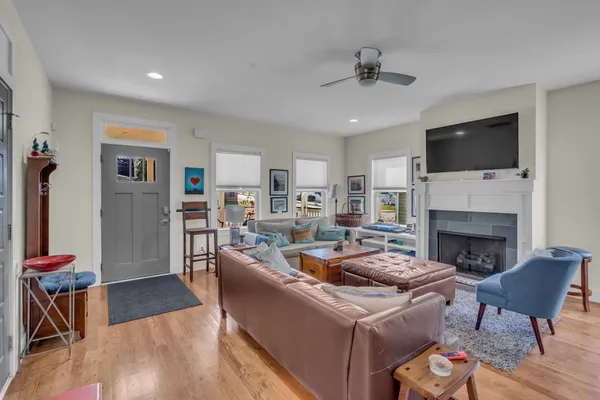 a living room with furniture fireplace and a flat screen tv