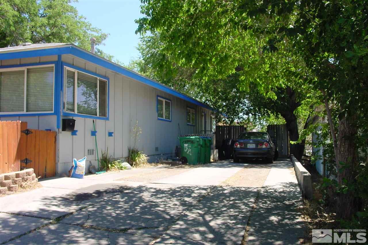 1110-1112 The Strand Reno, NV 89503 - Photo 2 of 13 a front view of a house with a yard
