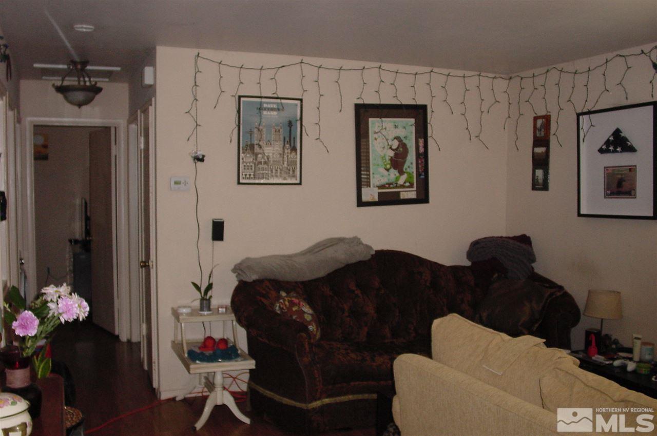 1110-1112 The Strand Reno, NV 89503 - Photo 6 of 13 a living room with furniture and flowers