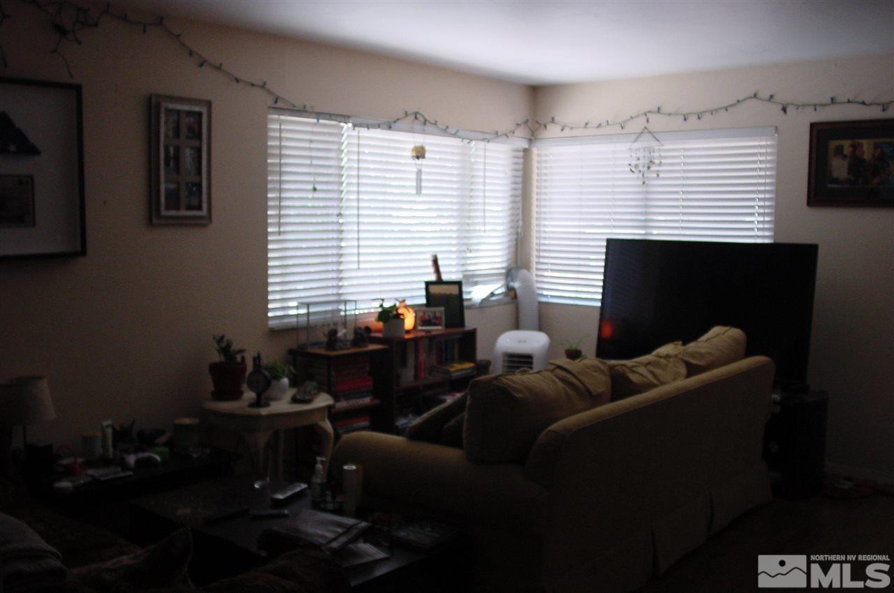 1110-1112 The Strand Reno, NV 89503 - Photo 8 of 13 a living room with furniture and a window