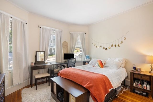 a bedroom with a bed and a table in it