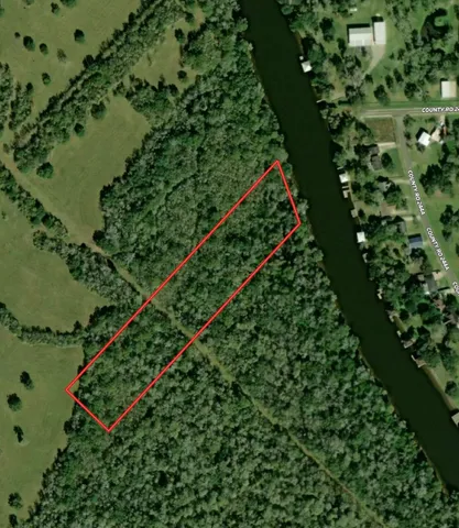 an aerial view of a residential houses with outdoor space