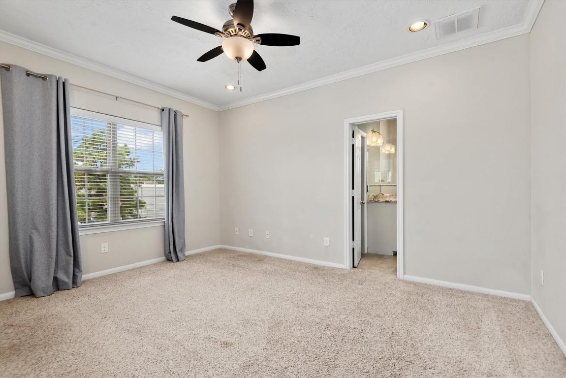 7036 West 43rd Street Houston, TX 77092 - Photo 19 of 28 a view of an empty room with a window