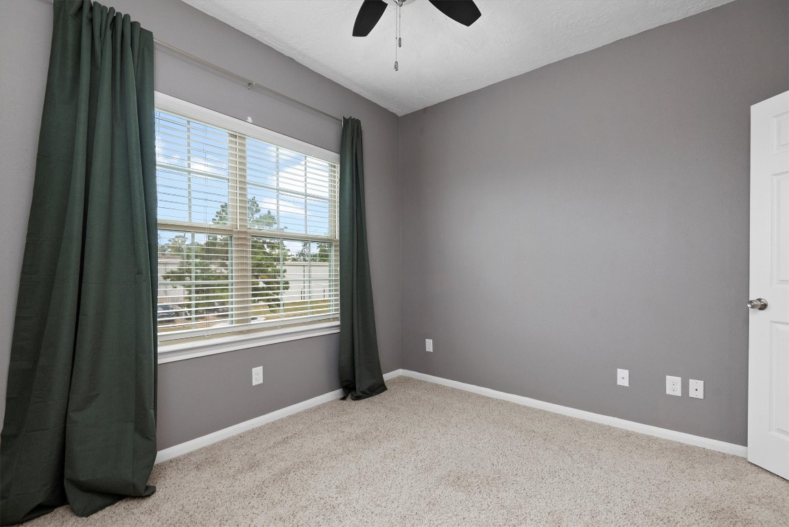 7036 West 43rd Street Houston, TX 77092 - Photo 24 of 28 a view of an empty room with a window