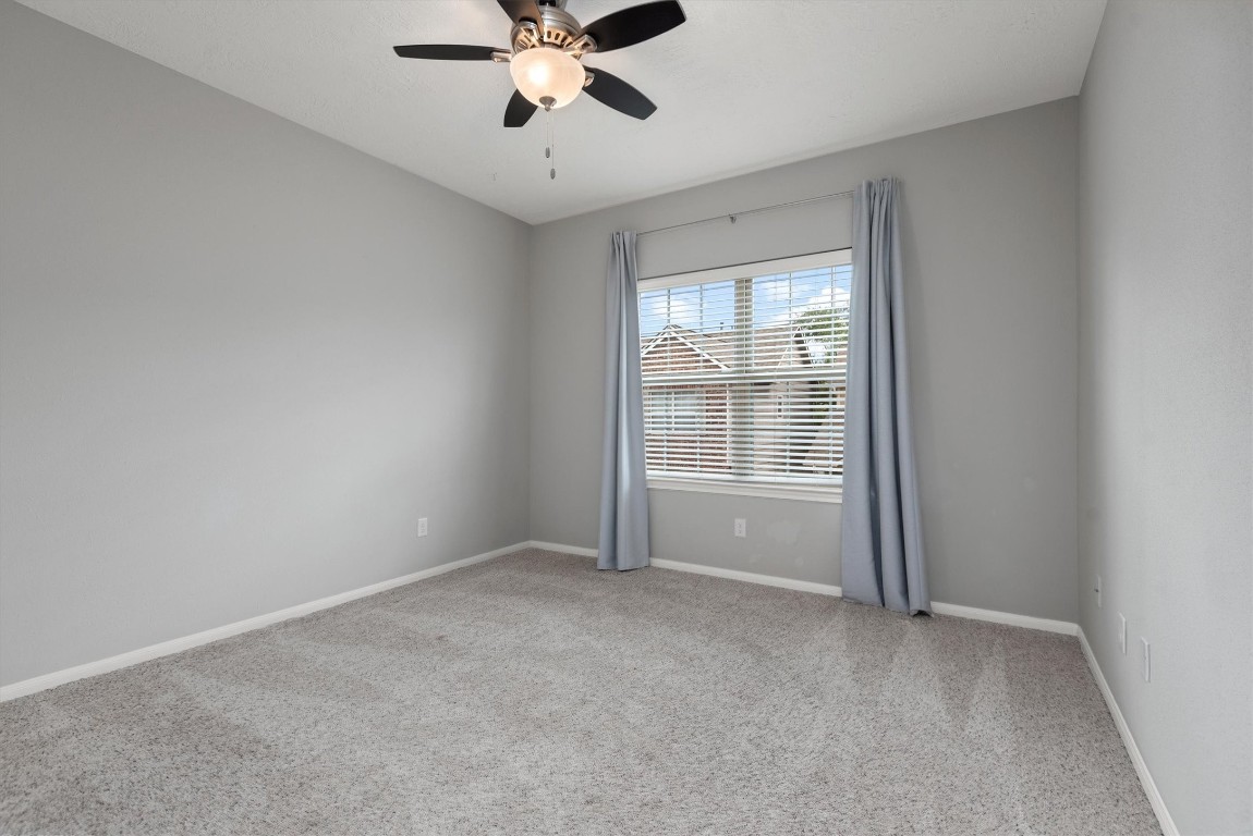 7036 West 43rd Street Houston, TX 77092 - Photo 27 of 28 a view of an empty room with a window