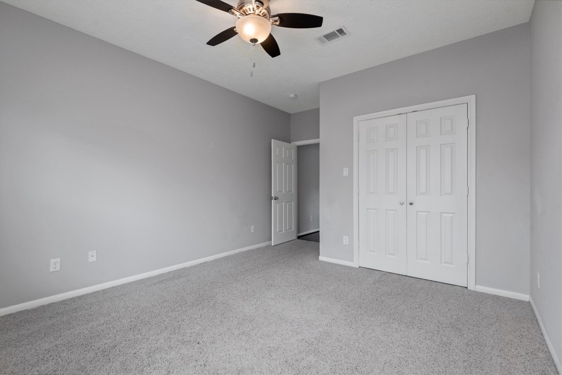 7036 West 43rd Street Houston, TX 77092 - Photo 28 of 28 a view of an empty room with a chandelier fan