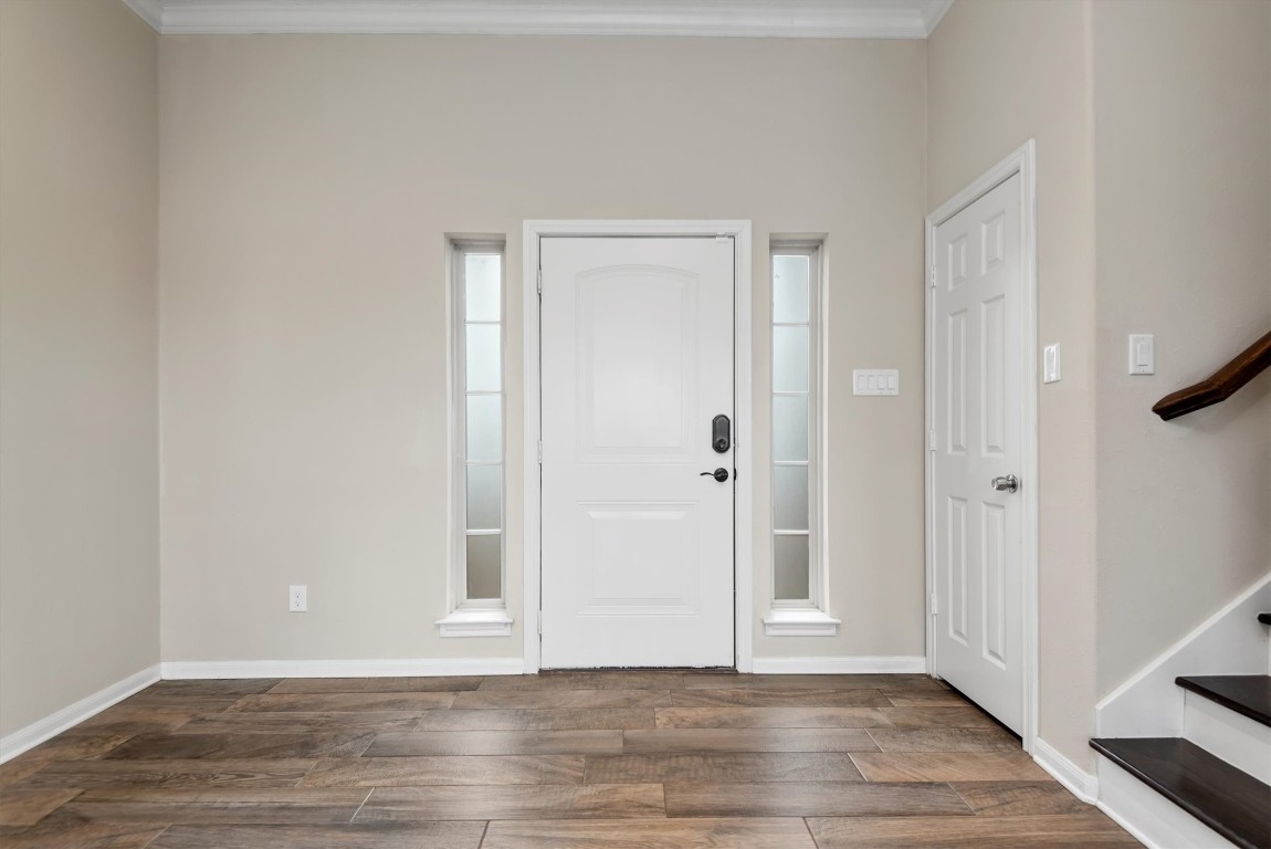 7036 West 43rd Street Houston, TX 77092 - Photo 7 of 28 a view of an empty room with wooden floor