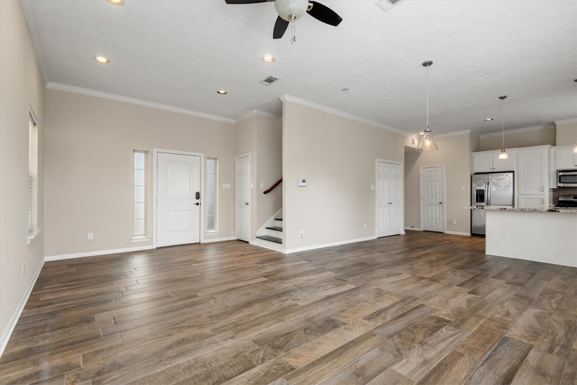7036 West 43rd Street Houston, TX 77092 - Photo 10 of 28 a view of an empty room with kitchen and a window