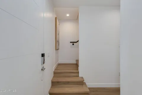 a kitchen with stainless steel appliances kitchen island granite countertop a stove a sink a dining table and chairs