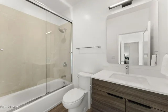 a bathroom with a shower and a toilet