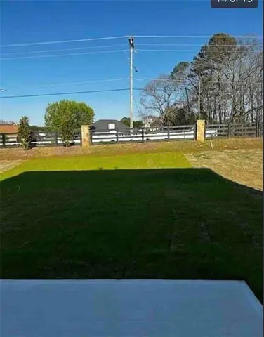 a view of a house with a big yard