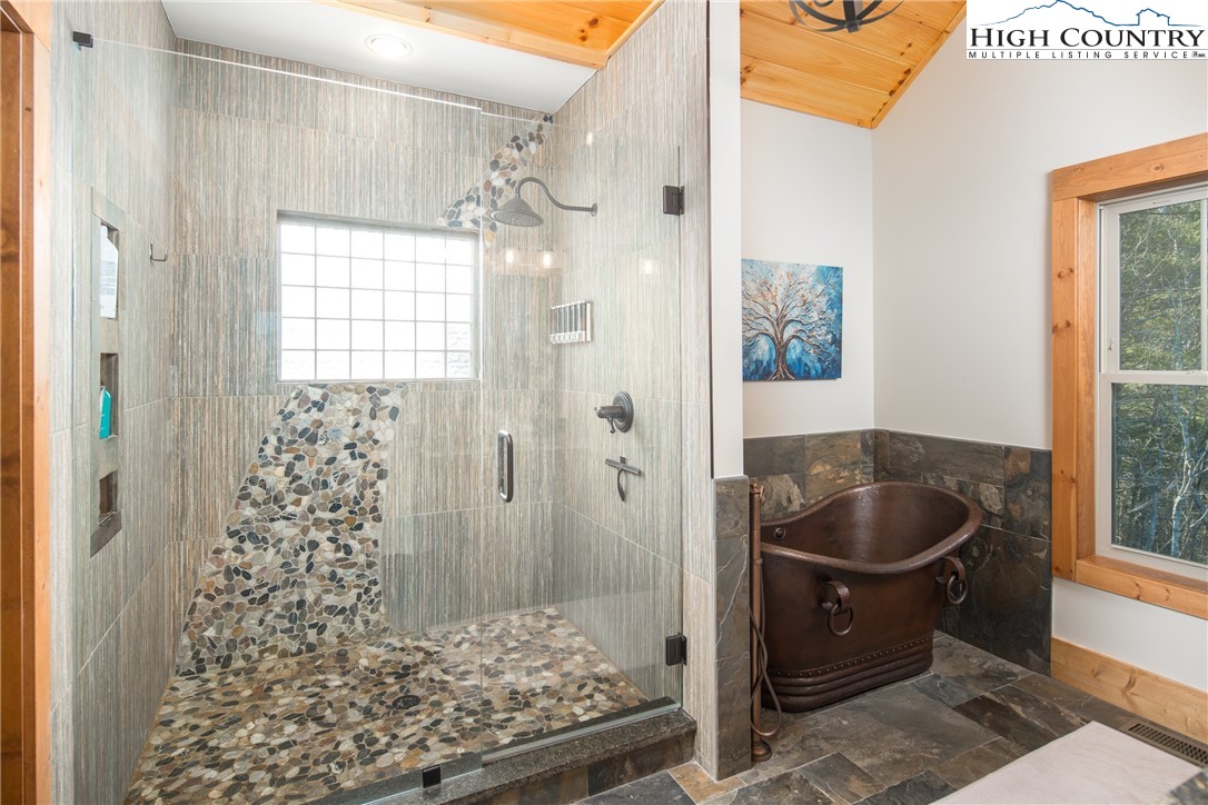 765 Pepperroot Road Boone, NC 28607 - Photo 17 of 35 a living room with a couch and a chandelier