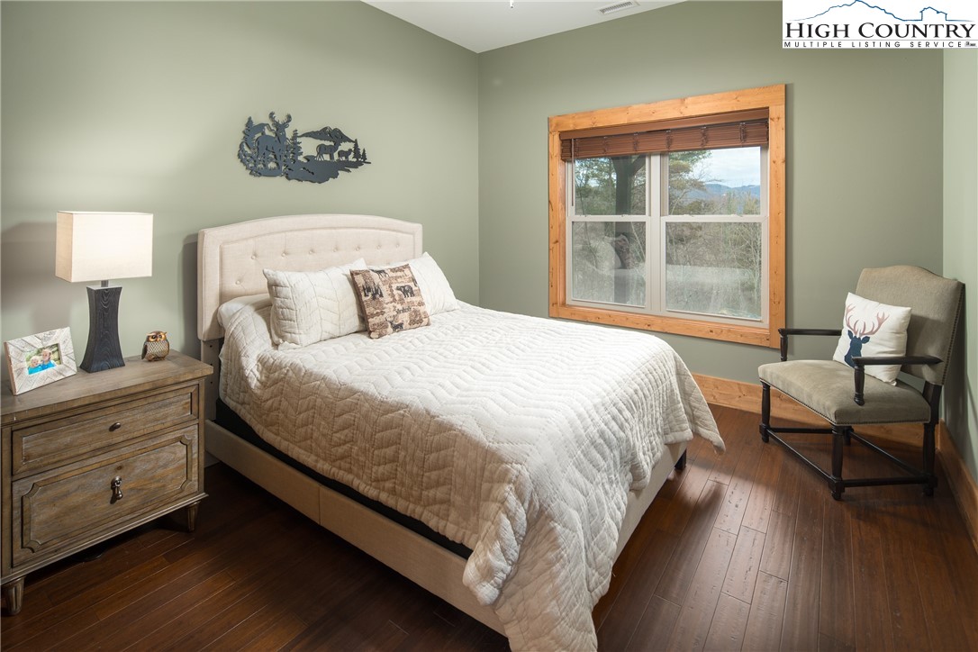 765 Pepperroot Road Boone, NC 28607 - Photo 27 of 35 a large bed sitting in a bedroom next to a window