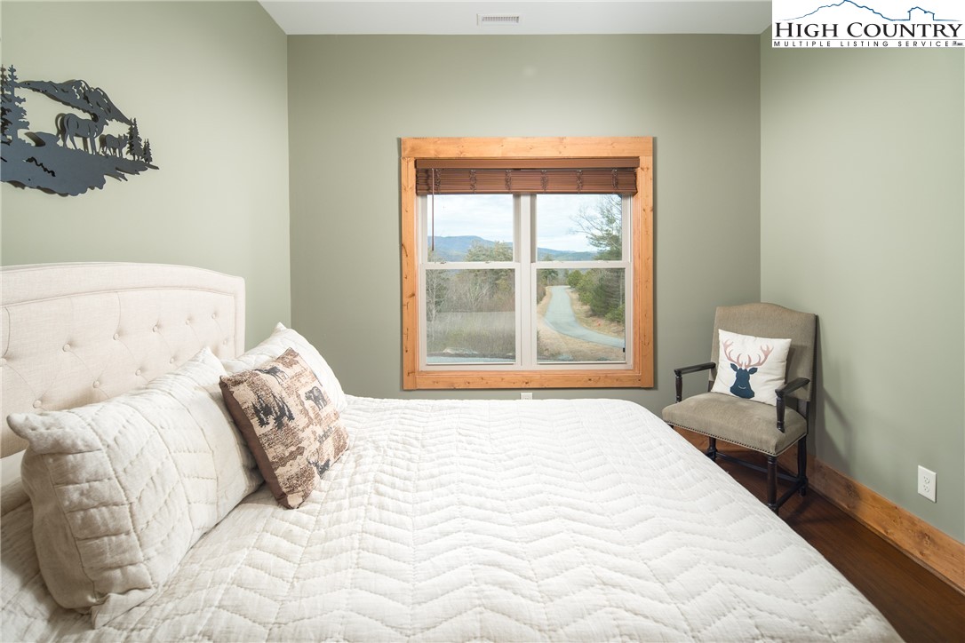 765 Pepperroot Road Boone, NC 28607 - Photo 28 of 35 a bedroom with a bed and window