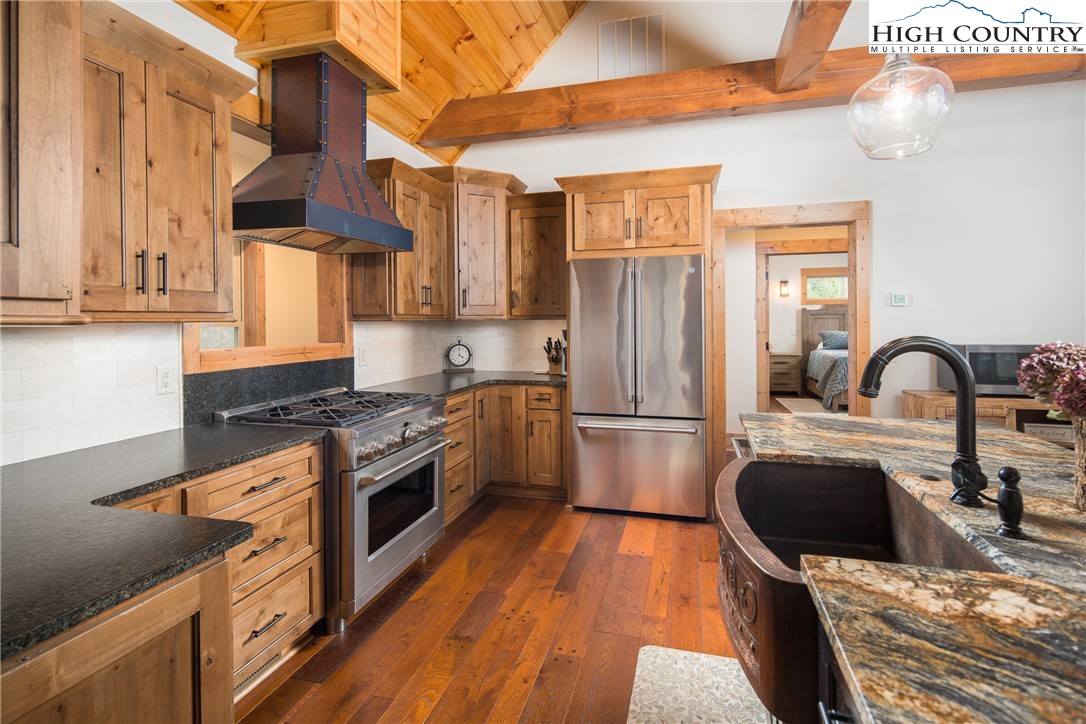 765 Pepperroot Road Boone, NC 28607 - Photo 7 of 35 a kitchen with stainless steel appliances granite countertop a stove a sink dishwasher and a refrigerator