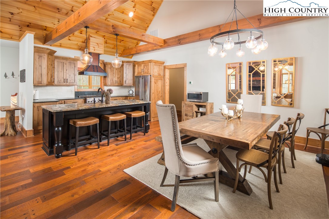 765 Pepperroot Road Boone, NC 28607 - Photo 9 of 35 a view of a dining room with furniture and wooden floor